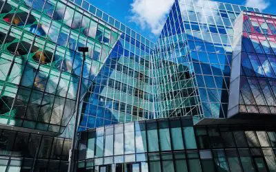 Modern building with reflective glass facade.