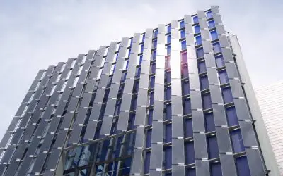 Modern building with reflective glass facade.
